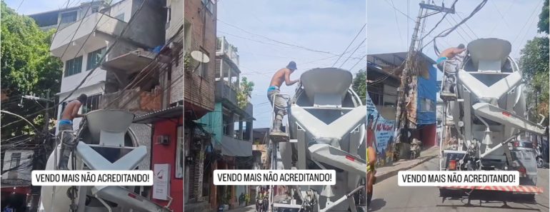 No Topo De Um Camião Betoneira, Trabalhador Levanta Os Fios Eléctricos à Passagem Do Veículo Pesado No Topo De Um Camião Betoneira, Trabalhador Levanta Os Fios Eléctricos à Passagem Do Veículo Pesado